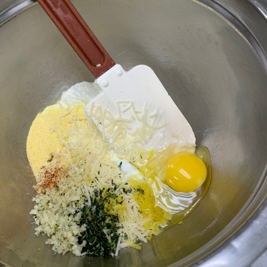 egg, cheese, herbs in bowl